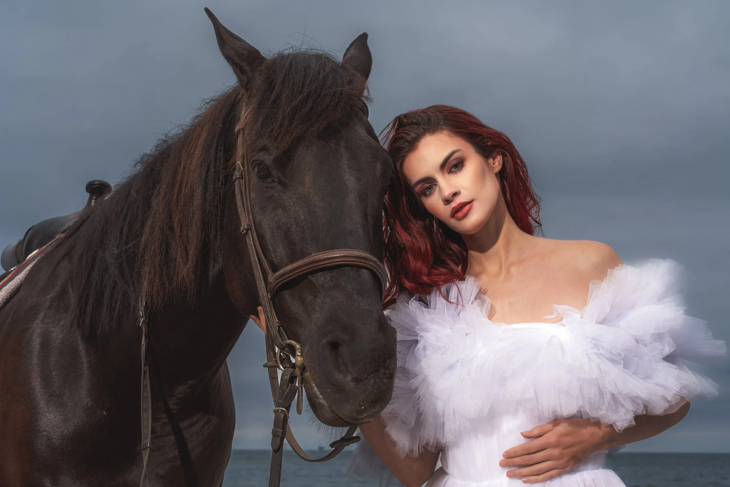 Horses and models on the beach