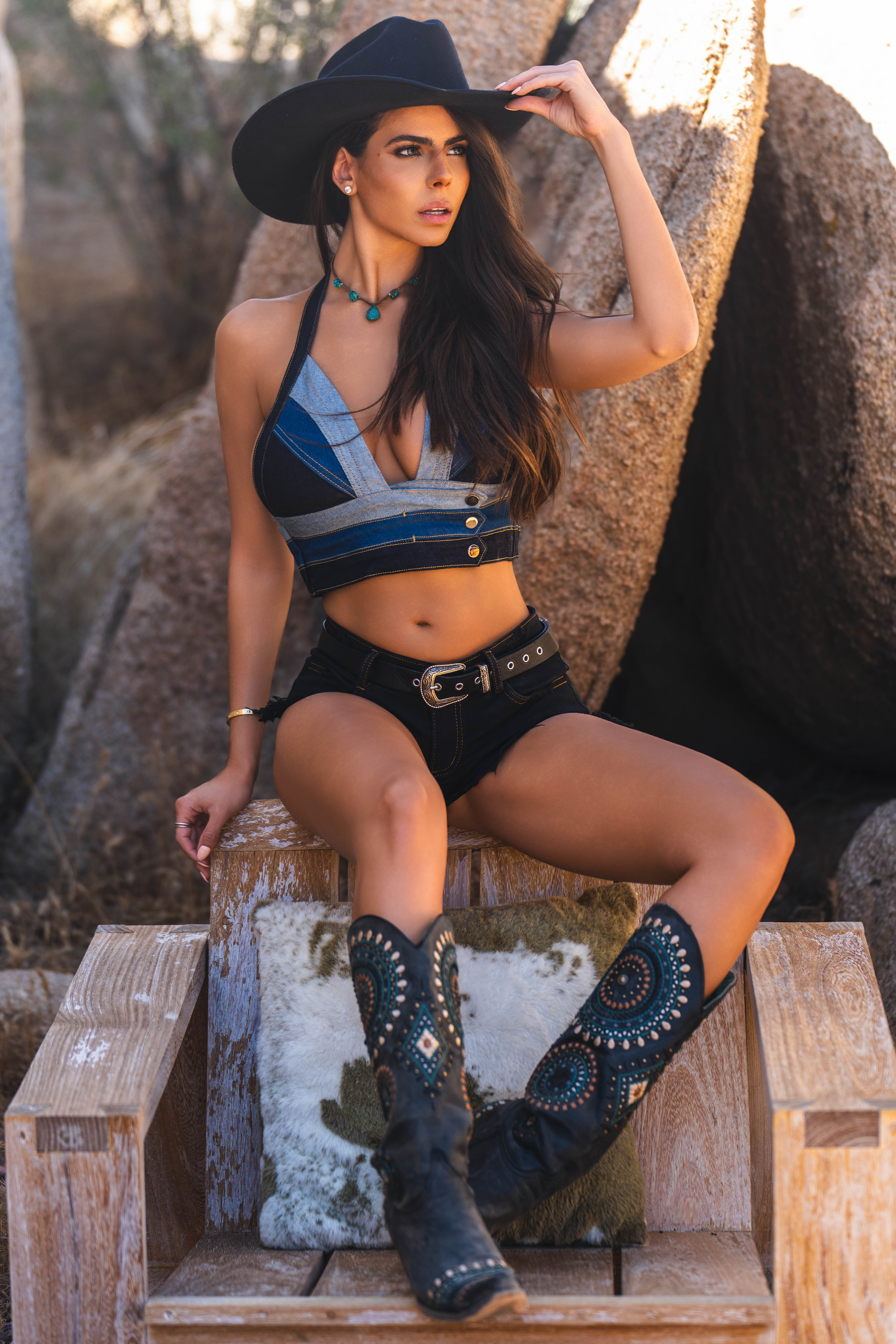 Full-body view of Dani Oliveira framed by Joshua Tree landscape