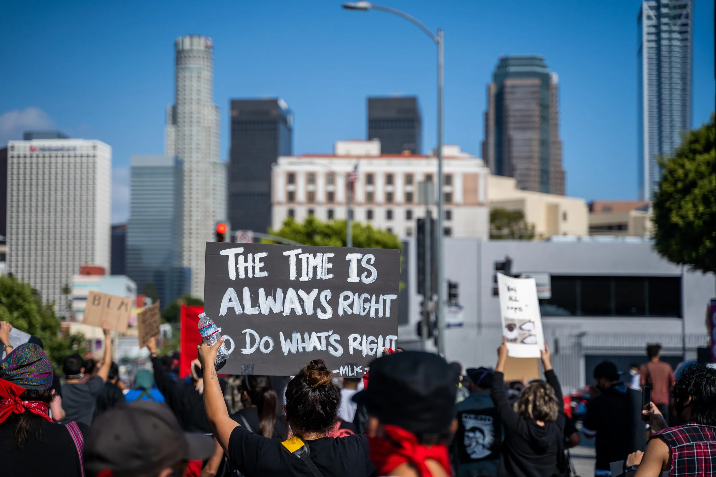 The time is always right to do what's right — MLK quote sign with LA skyline